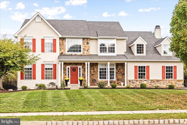 view of front of property with a front lawn