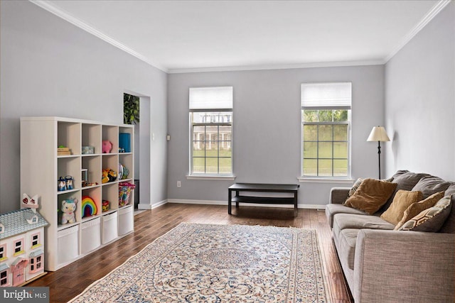 living room with crown molding, a healthy amount of sunlight, and wood-type flooring