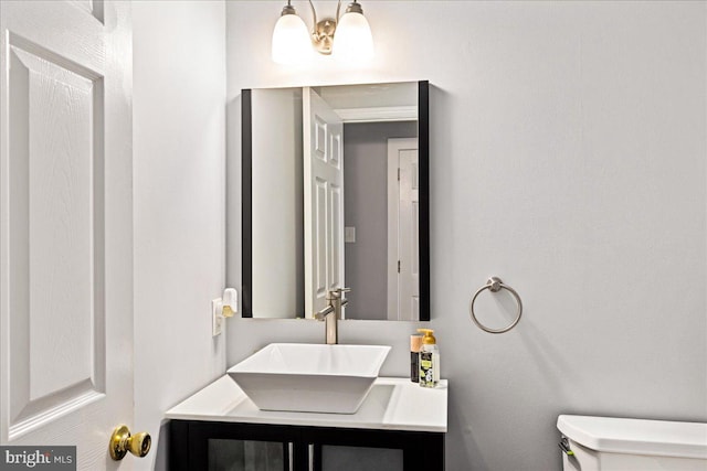 bathroom with vanity and toilet