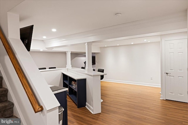 interior space featuring ornamental molding and wood-type flooring