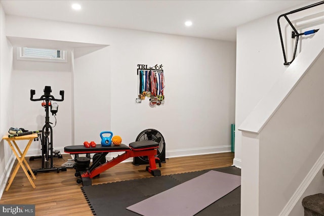 exercise area featuring hardwood / wood-style flooring