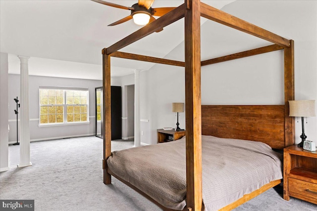 carpeted bedroom with ornate columns and ceiling fan