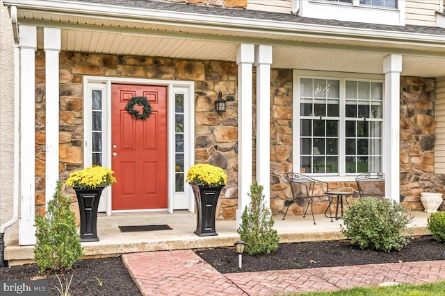 doorway to property featuring a porch