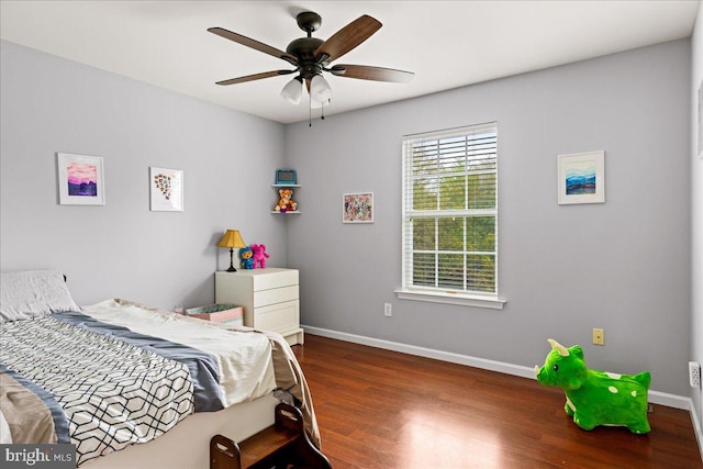 bedroom featuring ceiling fan and dark hardwood / wood-style floors