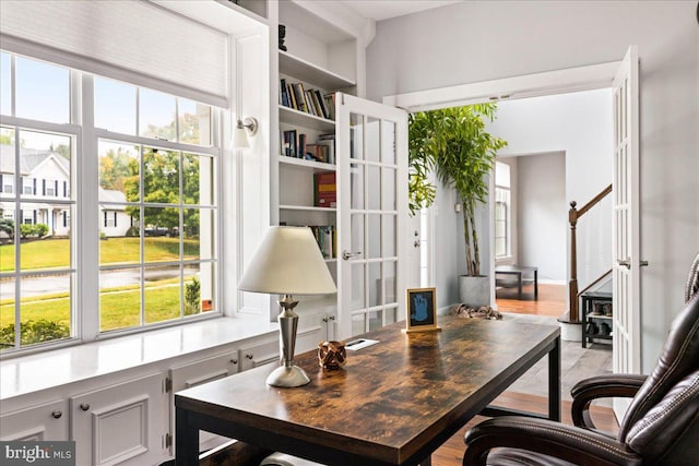 office space with a healthy amount of sunlight and light wood-type flooring