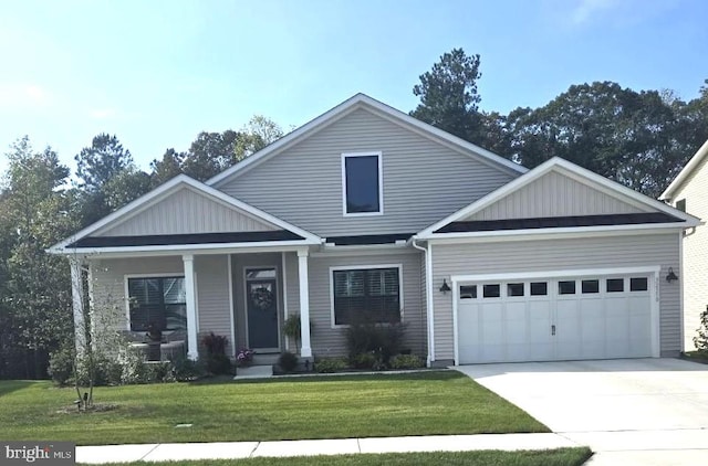 craftsman-style home featuring a garage and a front yard