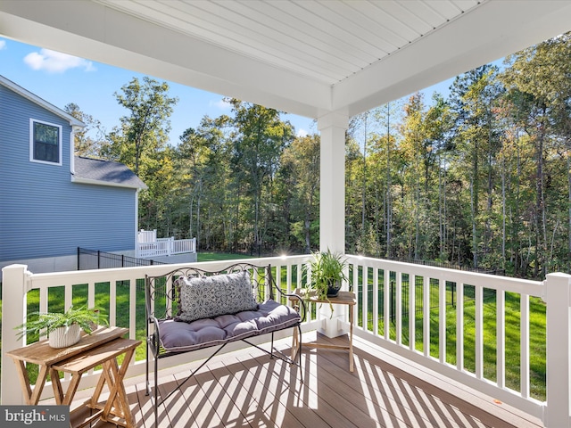 deck featuring a lawn