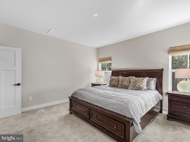 bedroom featuring light carpet