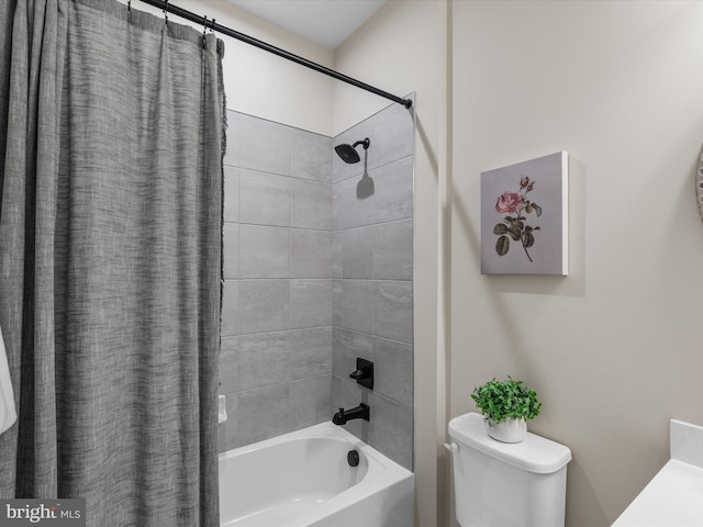 bathroom with shower / tub combo with curtain and toilet