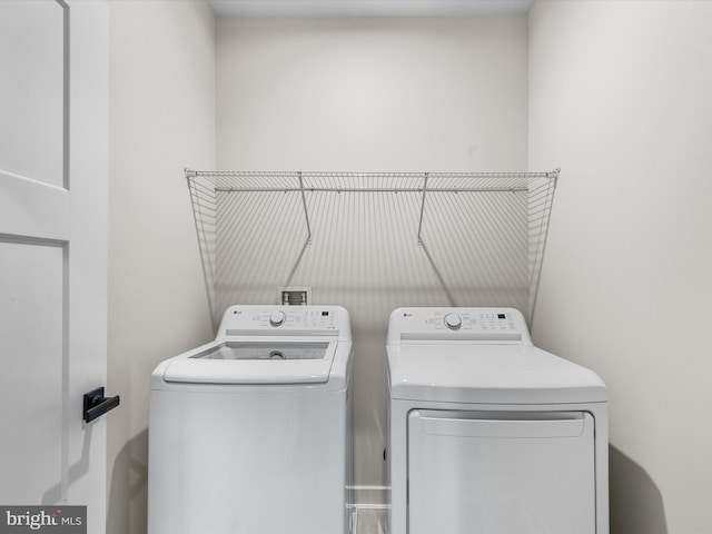 laundry area featuring washing machine and clothes dryer