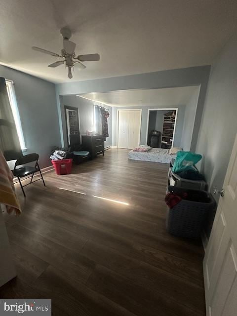 bedroom with ceiling fan and dark hardwood / wood-style floors