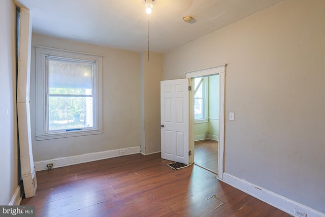 spare room featuring dark hardwood / wood-style floors