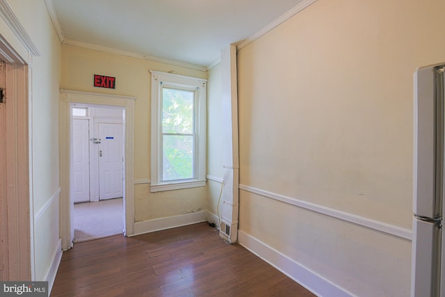 interior space with crown molding and dark hardwood / wood-style floors