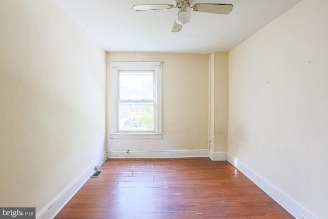 unfurnished room featuring ceiling fan and hardwood / wood-style floors