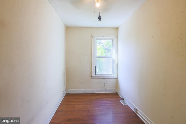 unfurnished room featuring dark hardwood / wood-style floors