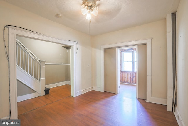 interior space with hardwood / wood-style floors, a textured ceiling, and ceiling fan