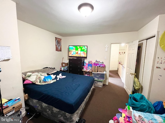 bedroom with dark colored carpet