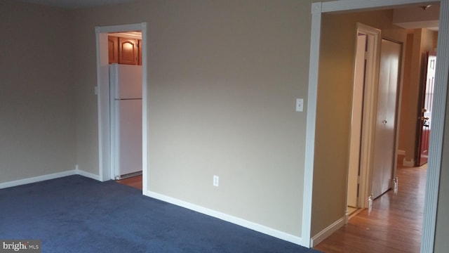 empty room featuring dark hardwood / wood-style flooring