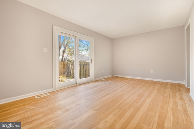 unfurnished room with light hardwood / wood-style flooring