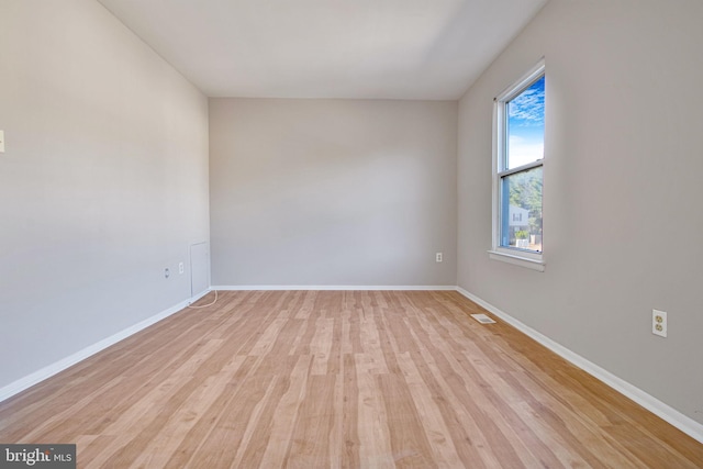 unfurnished room featuring light hardwood / wood-style flooring