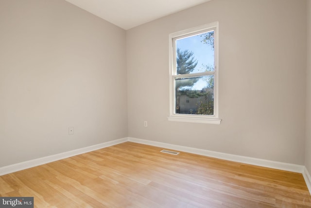 unfurnished room featuring light hardwood / wood-style floors