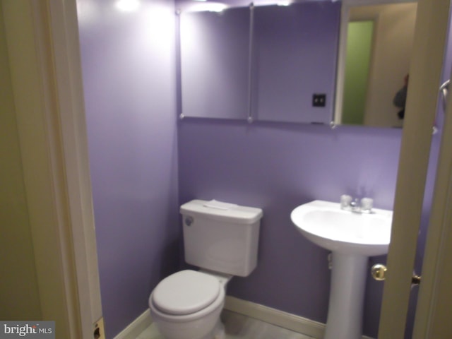 bathroom with sink and toilet