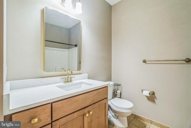 bathroom featuring walk in shower, tile patterned floors, vanity, and toilet