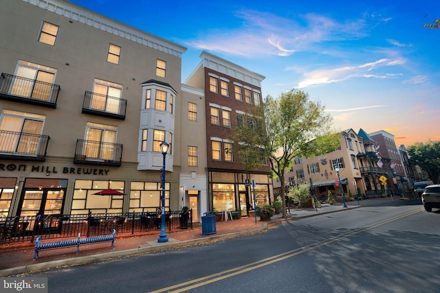 view of outdoor building at dusk