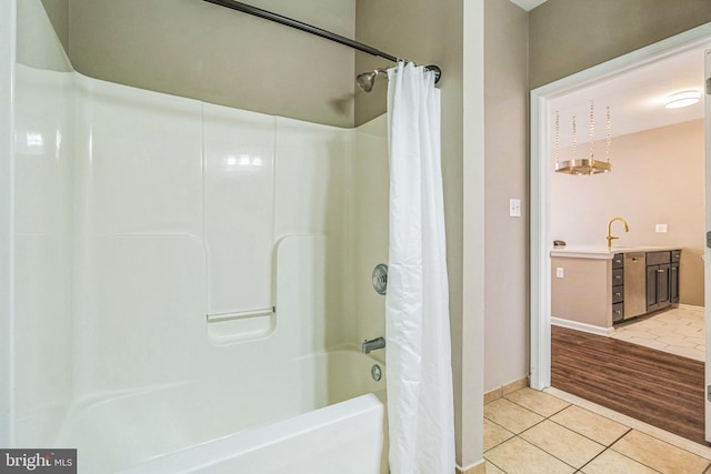 bathroom featuring vanity, shower / bath combo with shower curtain, and hardwood / wood-style floors