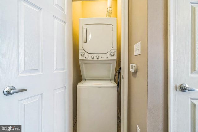 washroom with stacked washer / dryer