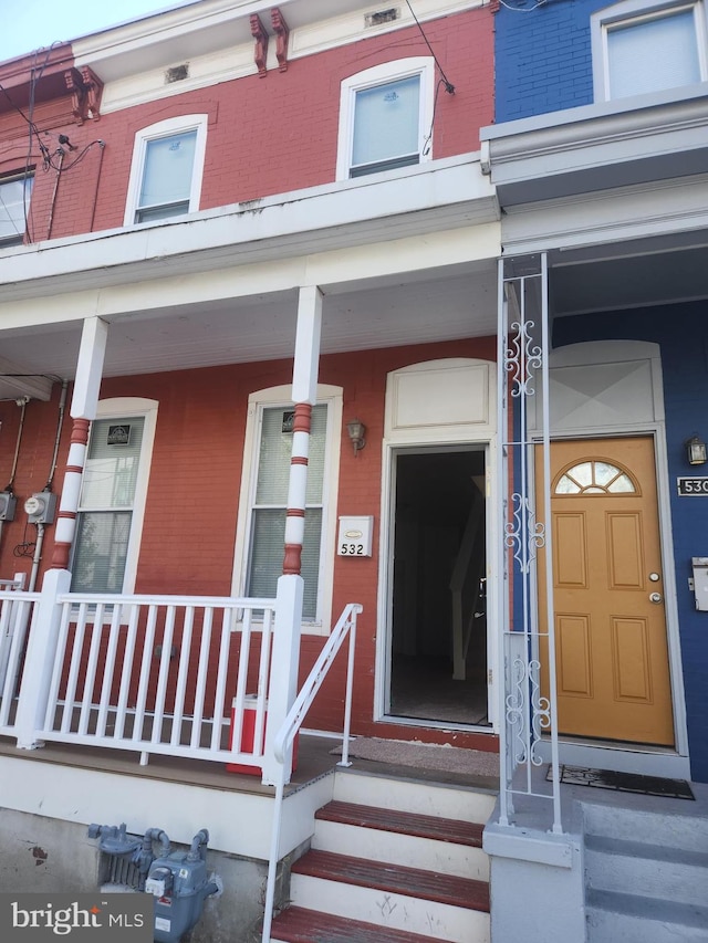 doorway to property with a porch