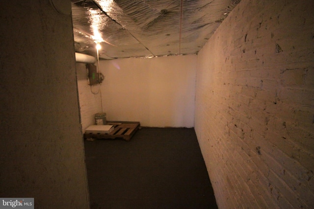 basement with brick wall