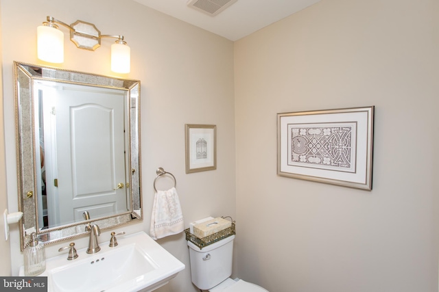 bathroom with sink and toilet