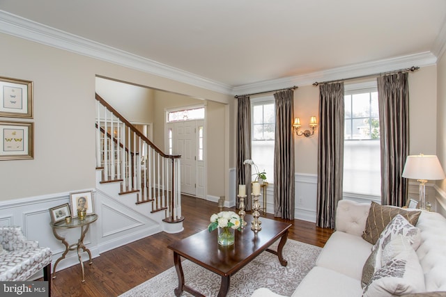 living room with ornamental molding and hardwood / wood-style floors