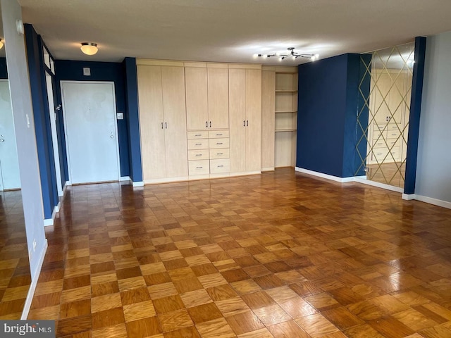 empty room with parquet flooring