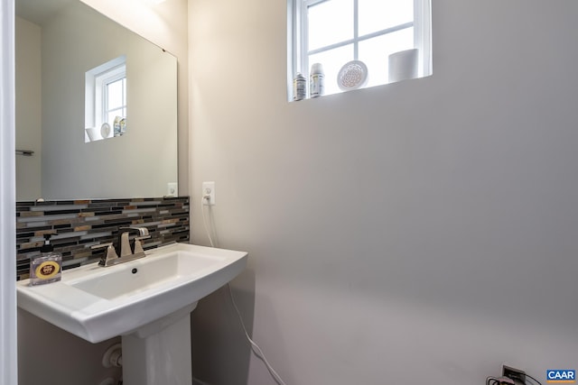 bathroom featuring backsplash