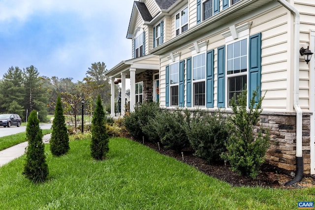 view of home's exterior with a lawn