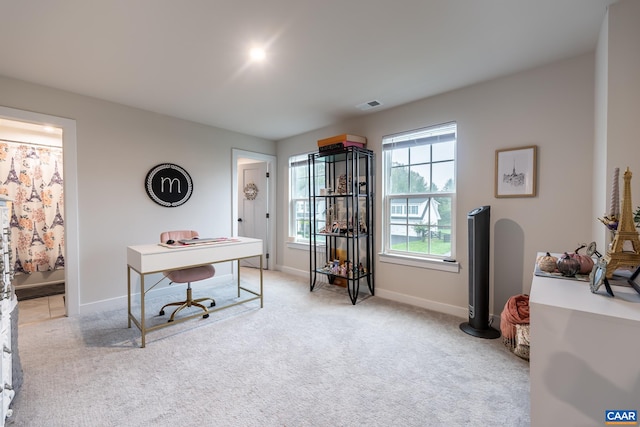 office space with light colored carpet