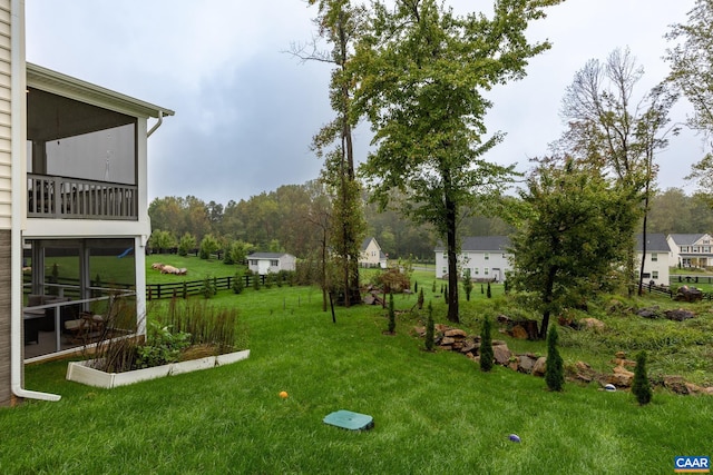 view of yard with a sunroom