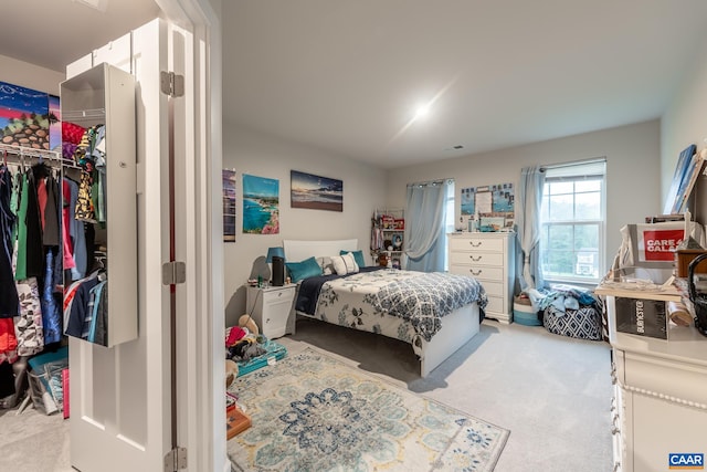 carpeted bedroom featuring a closet