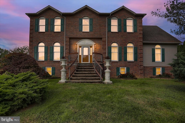 view of front of property with a lawn