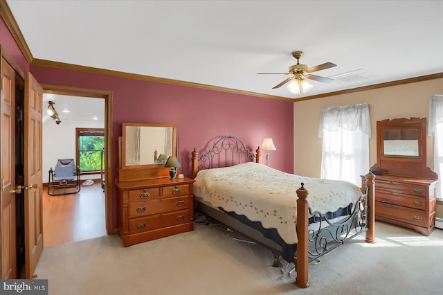 bedroom with crown molding, light carpet, multiple windows, and ceiling fan