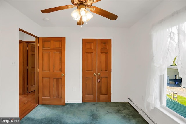 unfurnished bedroom with a closet, ceiling fan, carpet, and a baseboard radiator