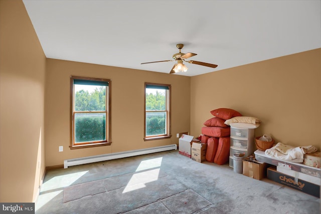 interior space featuring light carpet, baseboard heating, and ceiling fan