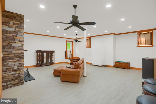 sitting room featuring ornamental molding, light wood-type flooring, and ceiling fan