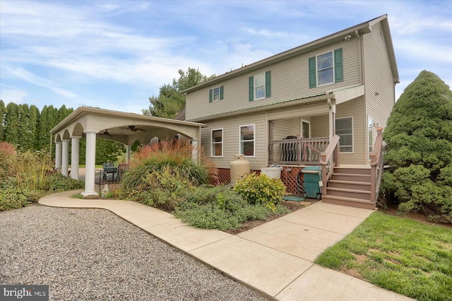 view of front of home featuring covered porch and ceiling fan