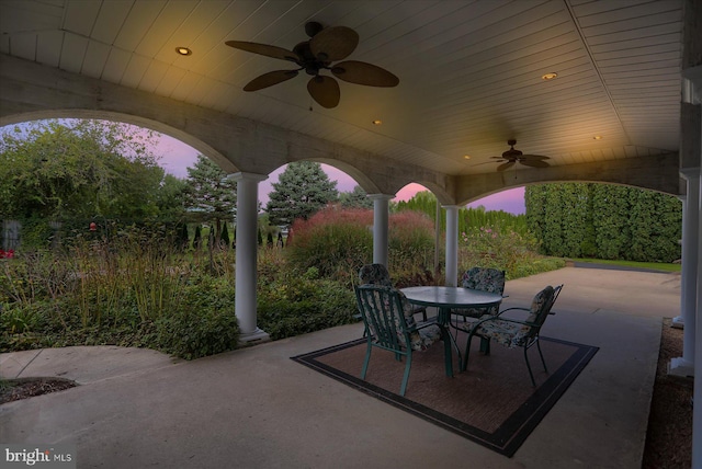 patio terrace at dusk with ceiling fan