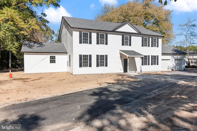 colonial inspired home with a garage