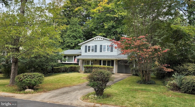 view of front facade with a garage and a front lawn