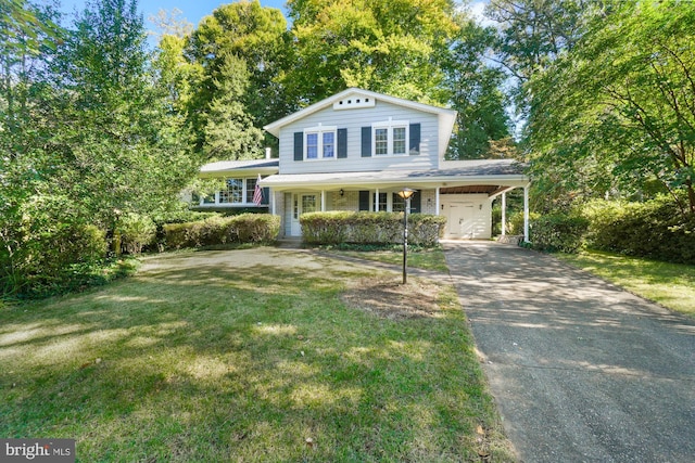 view of front facade with covered porch, a garage, a front lawn, and a carport